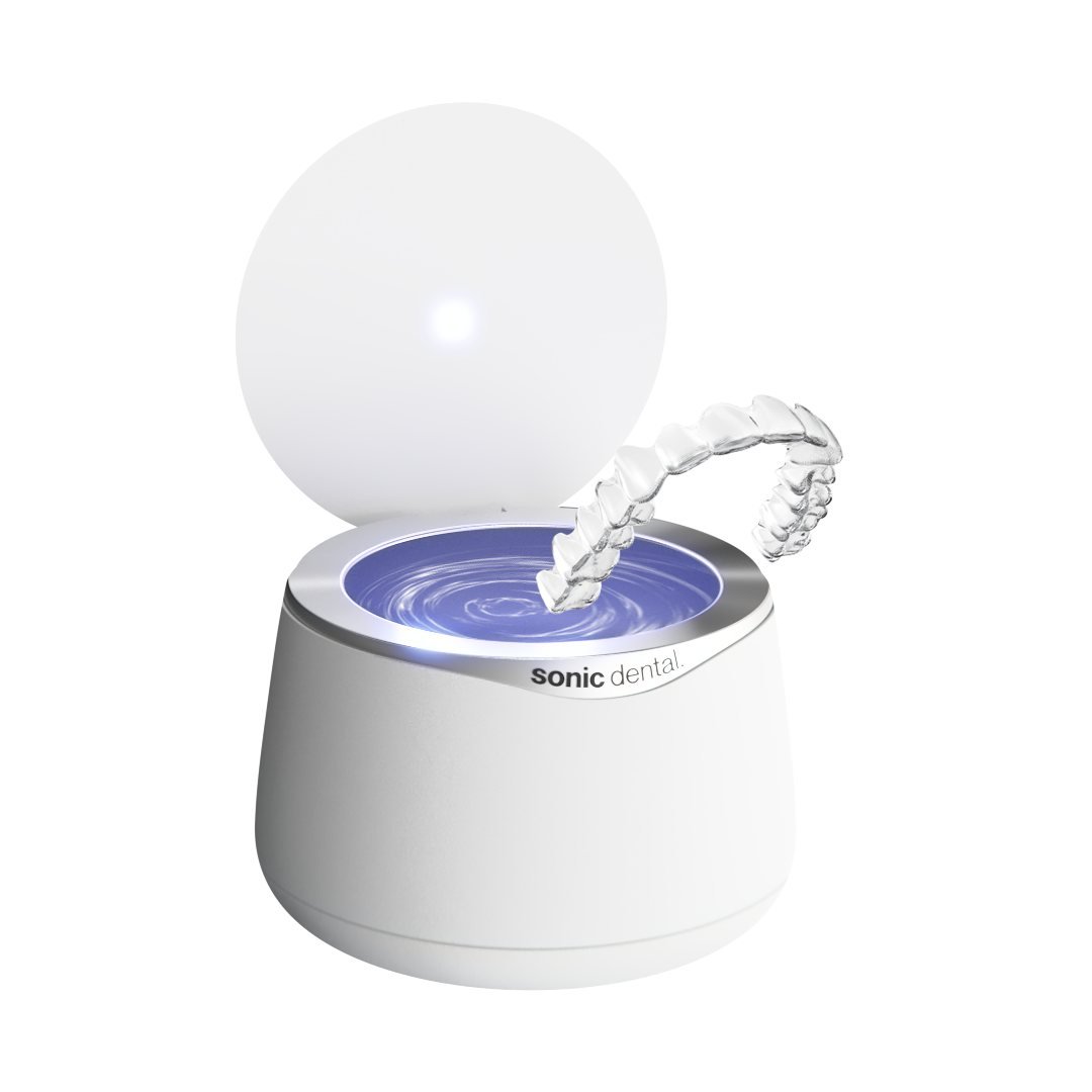 Manufacturer illustration of a white Sonic Pro cleaner with an open lid and a clear appliance above the tank.