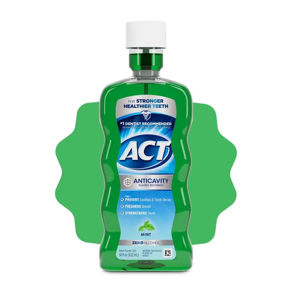 Green ACT Anticavity Mint mouthwash bottle with a white cap, shown against a green accent on white.
