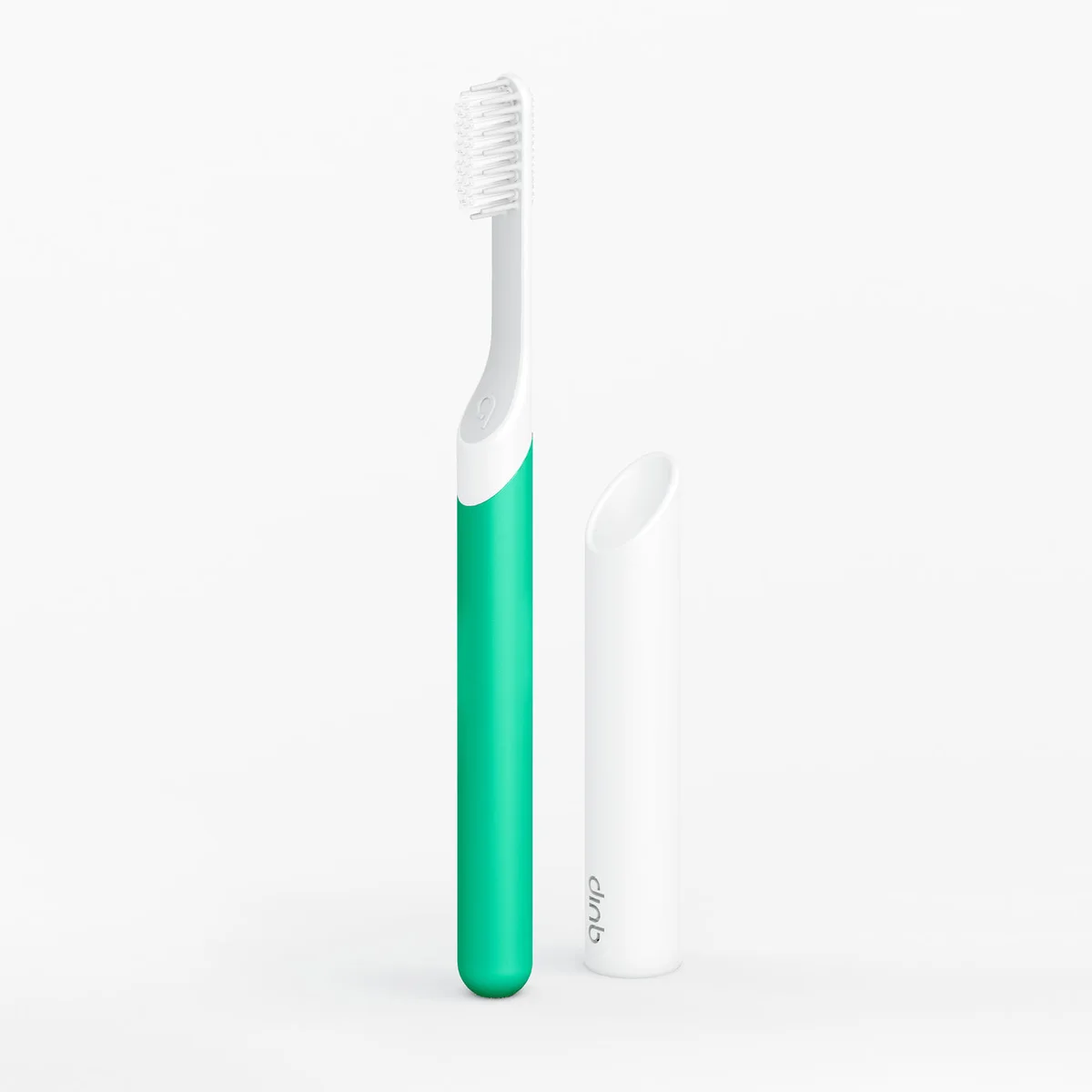Green quip Sonic electric toothbrush with a white brush head, standing beside its white travel cover.